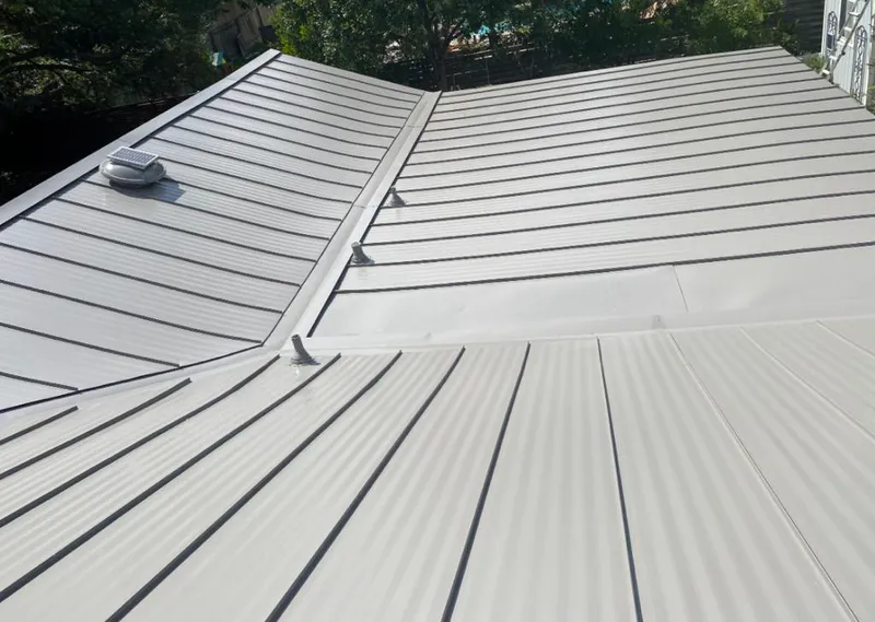 Solar attic fan installed on a metal roof for Roof Ventilation in Barnhart